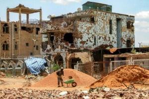 Sudanese lay first bricks to rebuild war