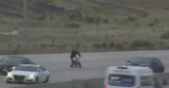 Person spotted crossing busy Colorado interstate on foot with bicycle