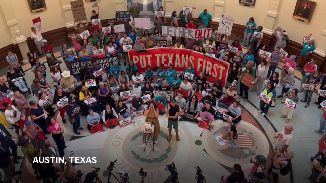 Opponents of Texas redistricting bill stage protest inside the Capitol rotunda