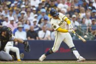 Brewers romp over Pirates to extend their winning streak to 12 games, keep pressure on Cubs