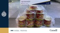 Traveller arrested trying to smuggle $2M worth of cocaine inside cans of cheese: CBSA