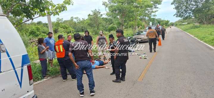 Pareja de motociclistas derrapa por bolsa de latas en la carretera Telchac Pueblo