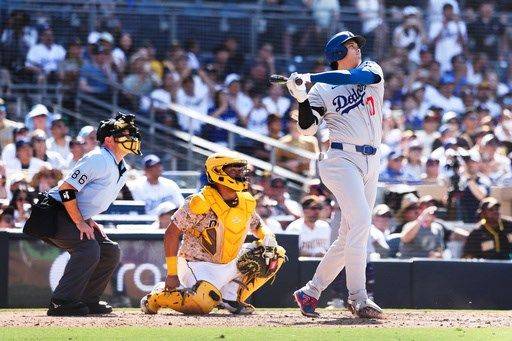 Shohei Ohtani high-fives a heckler after his homer to cap Dodgers' comeback rivalry win over Padres