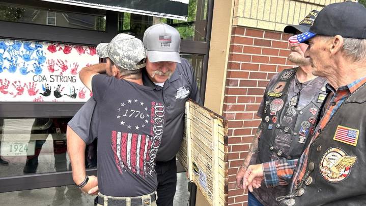 Veterans present wooden flag in honor of John Morrison, Frank Harwood