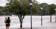 Hurricane Erin leaves rough seas with 2 swimmers dead and a search underway for a missing boater