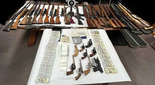 Detectives seize large stash of guns, drugs, cash in Marshall County