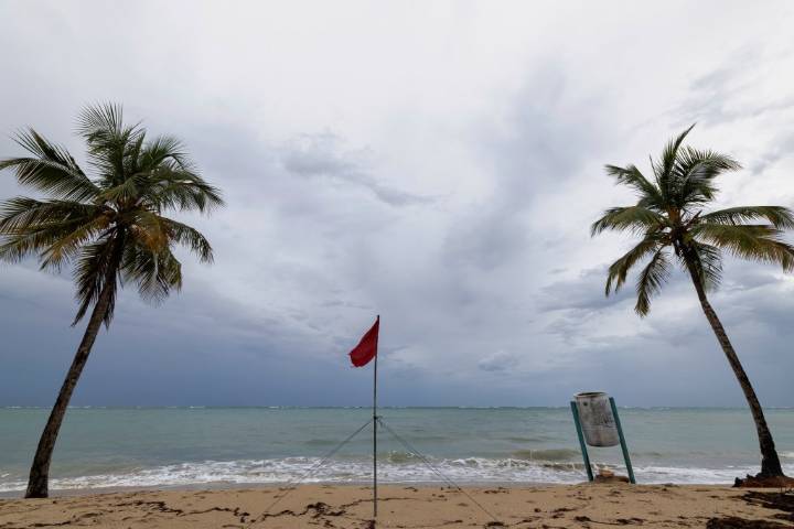 Hurricane Erin grows but weakens to Category 3, expected to miss U.S.