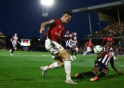 Soccer-Man Utd misery continues with League Cup shootout defeat to Grimsby