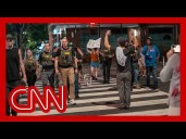 Crowd in DC outraged by federal law enforcement presence as cars stopped on busy street