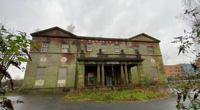 Firefighters battle to save Woolton Hall as roof collapses in Liverpool inferno