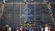 Ads prominent in college football going up at Michigan Stadium