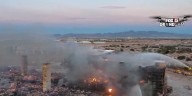 After massive fire at apartment construction site, spray used during rebuild to prevent fire