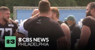 Landon Dickerson, fresh off surgery, serves up beers at Eagles