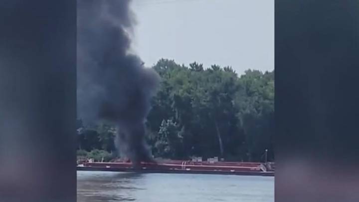 Two die when helicopter strikes powerlines and crashes into a barge on the Mississippi River
