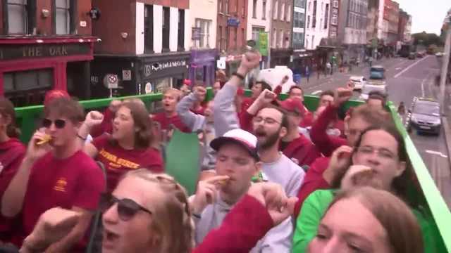 Iowa State band rides around Dublin in double-decker bus playing fight song on kazoo