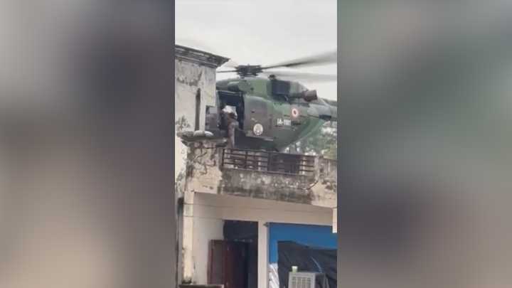 Military helicopter rescues people from collapsing building in India