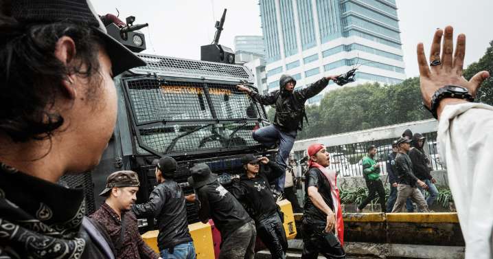 Riot police clash with students protesting lawmakers’ perks in Indonesia