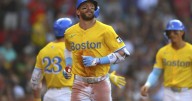 Trevor Story hits a 3-run homer as the Red Sox hold off the Marlins for a 7
