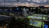 At the US Open, tennis stars shine under dark sky