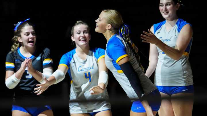 See best photos as nationally ranked Roncalli faces Carmel in girls volleyball