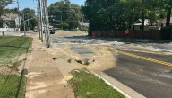Prairie Village, Kansas, water main break damages road