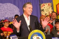 'Holding up a mirror': Newsom trolls Trump with mock painting of MAGA faithful praying over CA gov