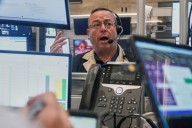 Stocks edge back from their latest all-time highs on Wall Street