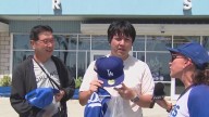 BTS member V throwing first pitch during Dodgers game