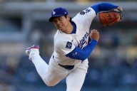 Shohei Ohtani gets first victory with Dodgers, striking out season