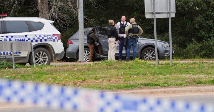 Police say 2 officers "murdered in cold blood" in Australia, triggering intense manhunt