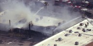 2nd-alarm fire at west Phoenix business leaves firefighter hurt; major road closed