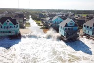 Wild video shows tidal surge swallowing homes as Hurricane Erin slams Outer Banks (Video)