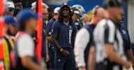 Dallas Cowboys' CeeDee Lamb takes big hit from sprinting official while on the sideline