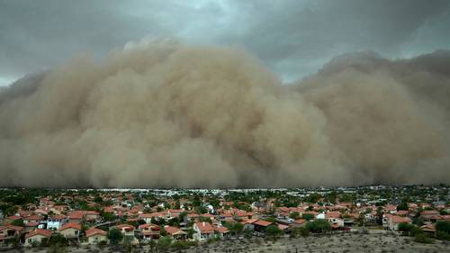 Towering wall of dust rolls through Phoenix; thousands without power