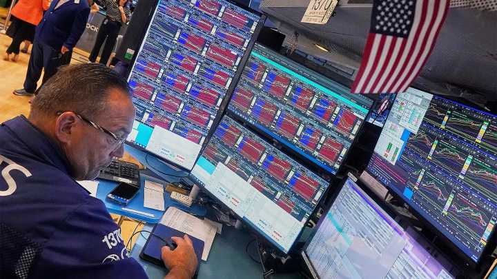 U.S. stocks slide following inflation report, but world shares are mostly higher