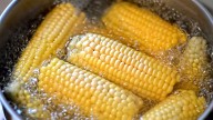 Want More Flavorful Corn? Add These 2 Pantry Staples To Your Boiling Water