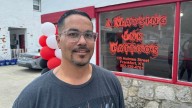 Recovery after flooding: A tattoo artist inks a new storefront