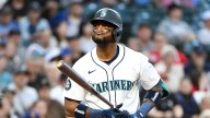 Seattle Mariners' Robles throws bat at pitcher in rehab game