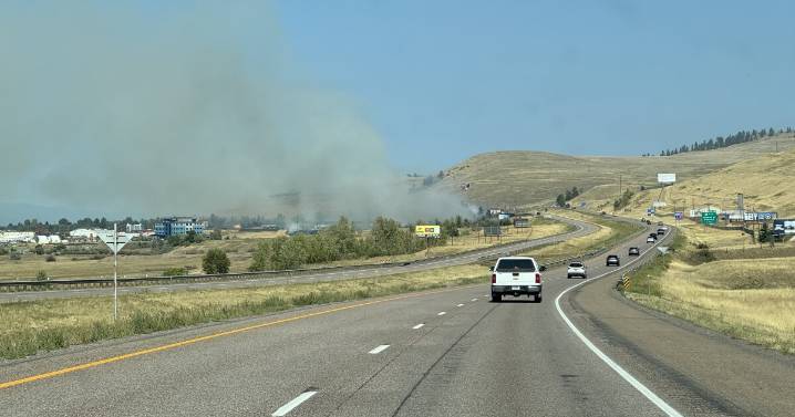Grass fire along I-90 in Missoula contained to 10 acres after threatening RVs
