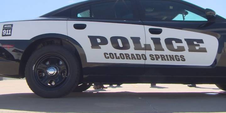 Car crashes into Colorado Springs police cruiser after rocks and concrete spill on I