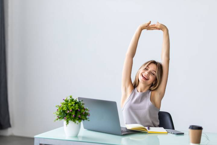 I do this quick chair exercise every day to beat back pain and strengthen my core while I work