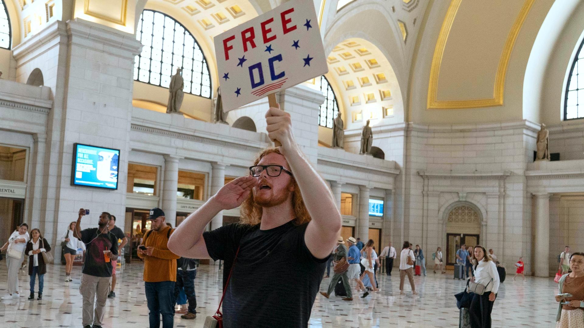 Protesters gather in Washington's Union Station as JD Vance and Pete Hegseth meet with troops