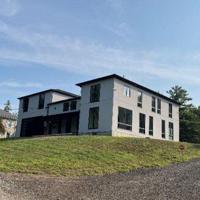 Cambridge homeowner wins fight to keep two-storey addition built without permit