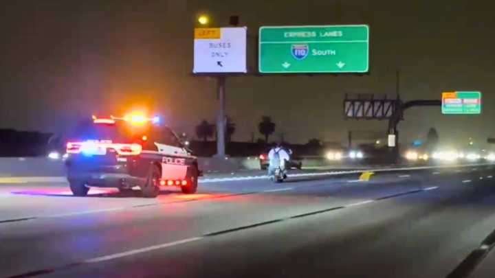Minibike rider tries to outrun officers on Southern California freeway