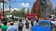 Video: Mujer se salva de milagro y hombre queda prensado en choque en avenida 608
