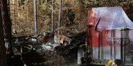 One person displaced by camper and truck fire