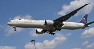 Heathrow flight raided by police after passenger 'tried to hit crew and open plane door'