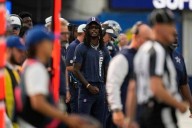 CeeDee Lamb takes big hit from sprinting official while WR is in street clothes on the sideline