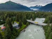 Alaskan glacier ice dam releases floodwater toward downstream homes