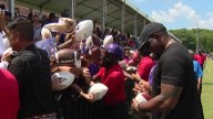 Michael Phelps attends Ravens training camp at player's request